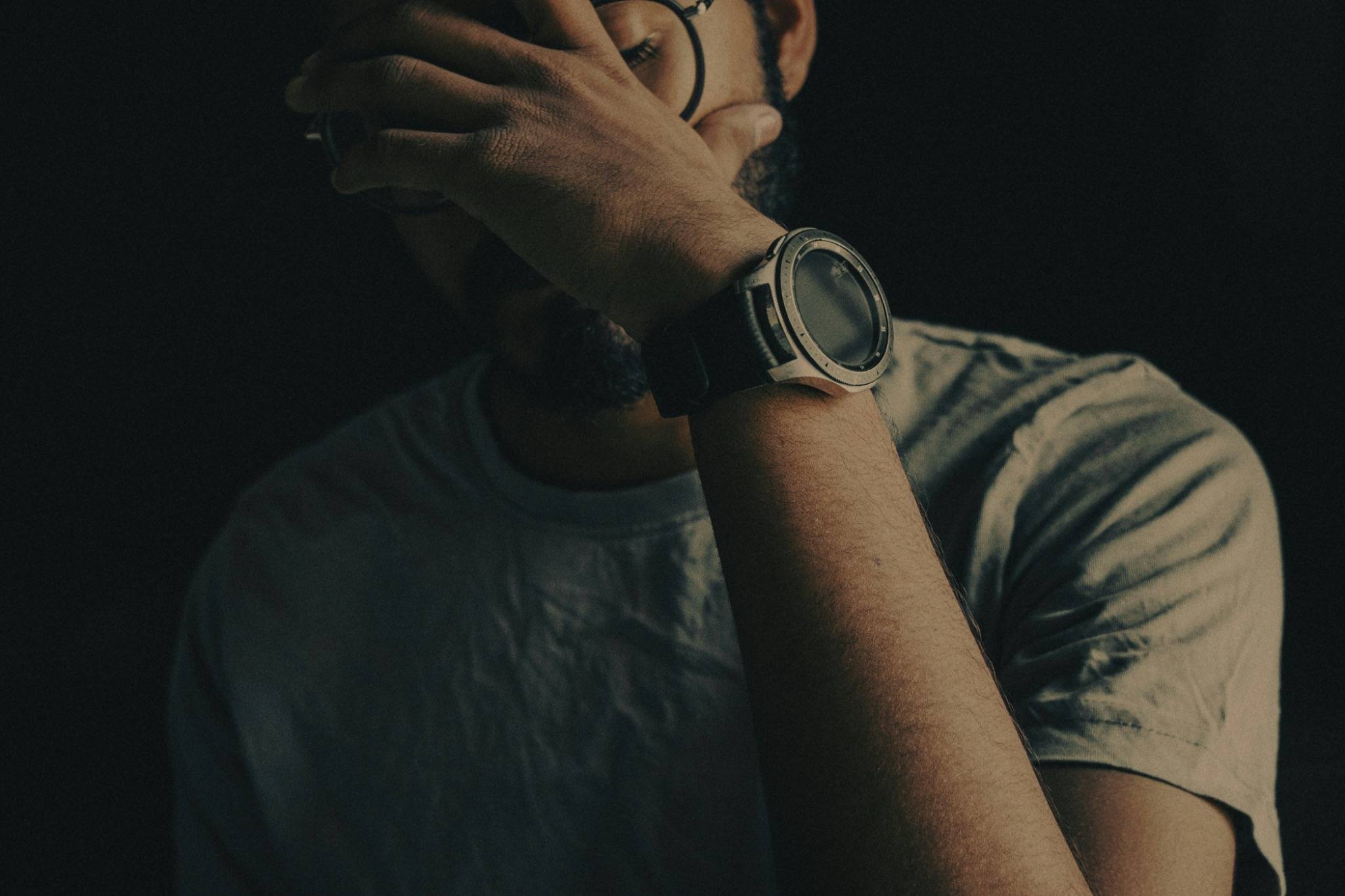 Man covering face in emotional distress, symbolising hidden feelings and emotional defences – psychodynamic therapy in Haywards Heath and Crowborough.